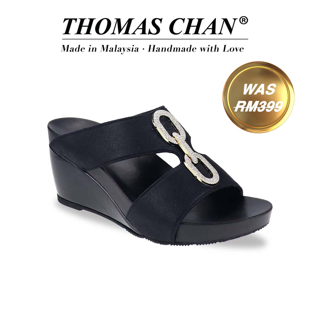 Aurora Chain High Wedges – diagonal view on white background, highlighting crystal buckle and glossy wedge texture. "THOMAS CHAN®" brand displayed with "Made in Malaysia · Handmade with Love" below. Gold and white banner highlights special offer: "Was RM399".