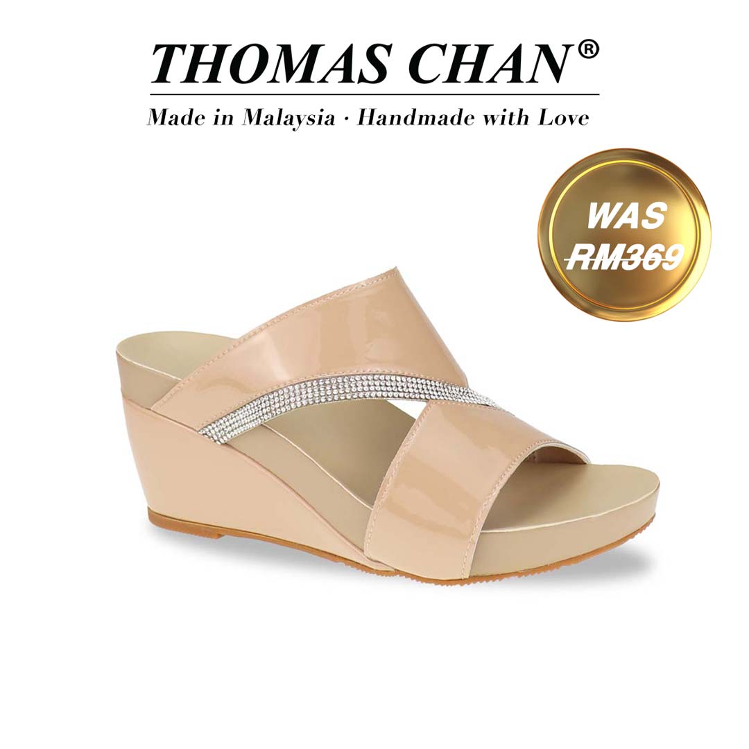 A sleek diagonal profile of the Thomas Chan Diamond Strap Dinner Wedges from the Arch-legance collection, showcasing the elegant multi-row diamond strap and a low wedge heel for a graceful lift. The Orthotic Arch-legance footbed ensures both style and comfort."THOMAS CHAN®" brand displayed with "Made in Malaysia · Handmade with Love" below. Gold and white banner highlights special offer: "Was RM369".