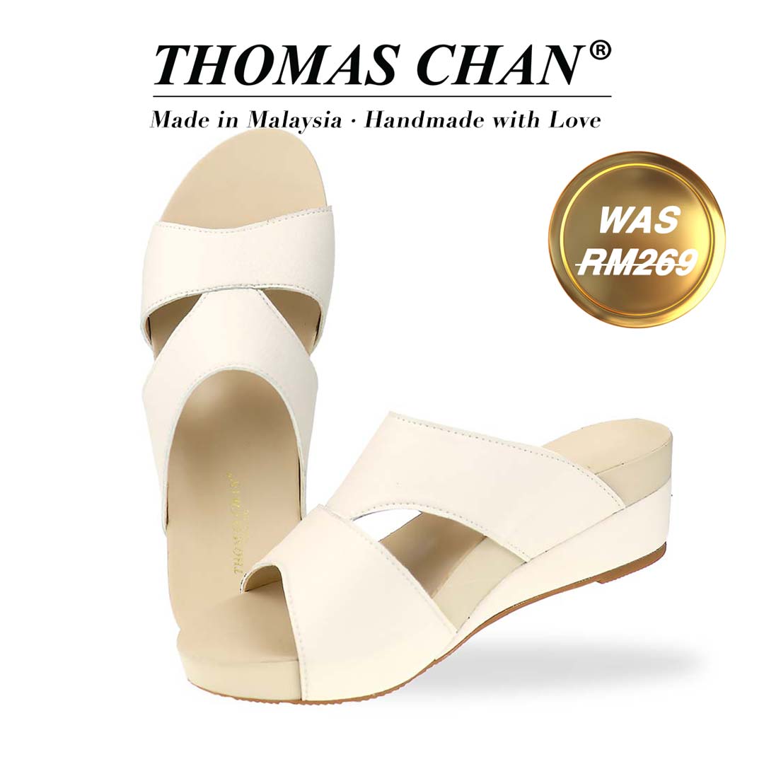 Thomas Chan's Pebble Lychee Everyday Low Wedge Slides in ivory, featuring an arch-support footbed. The "THOMAS CHAN®" brand is displayed with "Made in Malaysia · Handmade with Love" below. A gold and white banner highlights a special offer: "Was RM269."