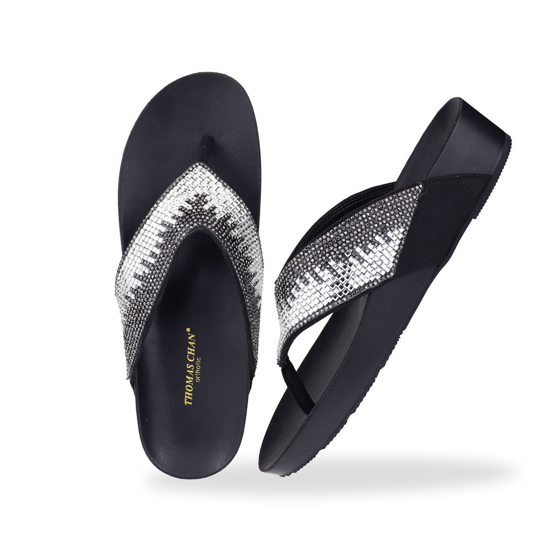 Full view of Thomas Chan’s black suede rhinestone flip-flops highlighting the elegant suede texture, rhinestone detailing, and LiteStep flatform footbed.