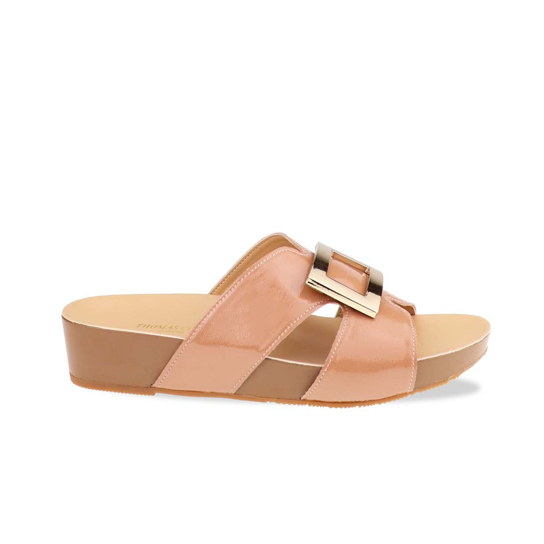 Side profile of Thomas Chan LiteStep flatform sandals in nude patent leather, featuring square gold buckle, on white studio backdrop.
