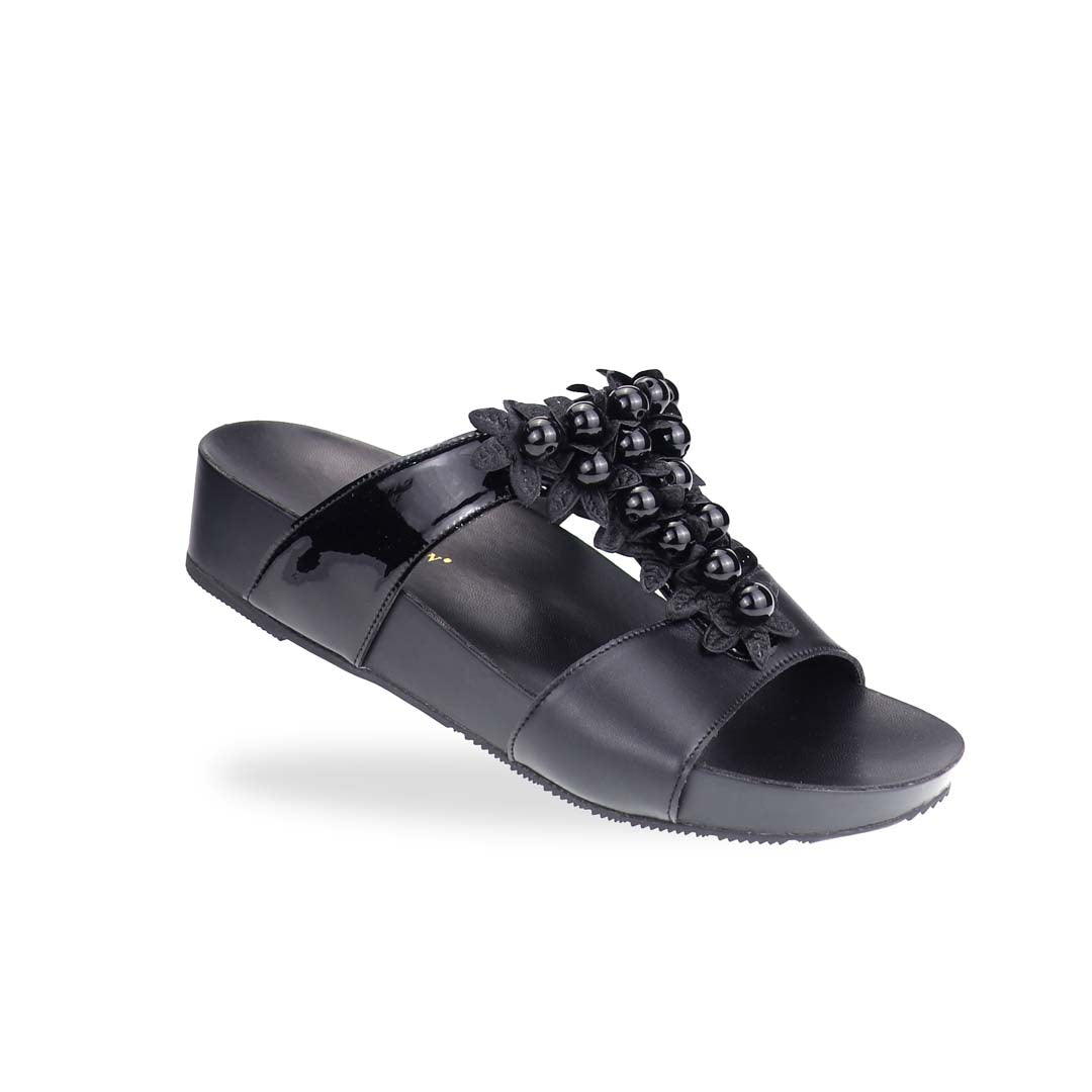 Diagonal view of Thomas Chan Petal Pearl Flatform Sandals in black—highlighting pearl-petal embellishments and gentle height from LiteStep sole.