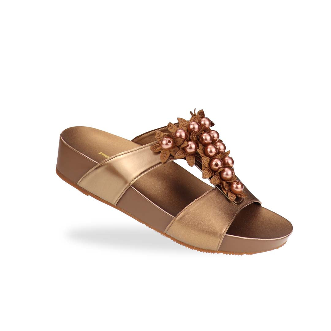 Diagonal view of Thomas Chan Petal Pearl Flatform Sandals in bronze—highlighting pearl-petal embellishments and gentle height from LiteStep sole.