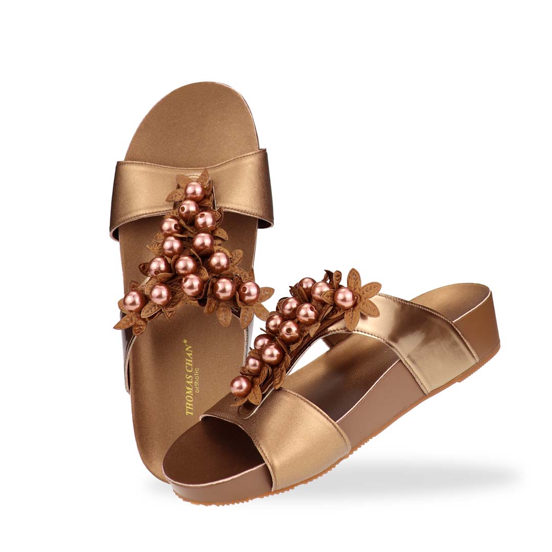 Full view of Thomas Chan Petal Pearl Flatform Sandals—showing symmetrical flower pearl accents and lightweight flatform sole in bronze.