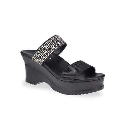 Diagonal view of Thomas Chan's Strappy Rhinestone Cushioned Heels in black: With a built-in cushioned footbed and a chic two-strap design, these heels offer a sleek front stripe complemented by a dazzling rhinestone strap at the back.