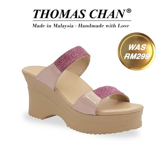 A diagonal view of 3-inch Thomas Chan Multi-Row Diamond wedge heels from the Cushioned Footbed Series, featuring a nude-tone sole and glossy pink patent straps adorned with sparkling multi-row diamond embellishments. Designed for both elegance and comfort. "THOMAS CHAN®" brand displayed with "Made in Malaysia · Handmade with Love" below. Gold and white banner highlights special offer: "WAS 269."