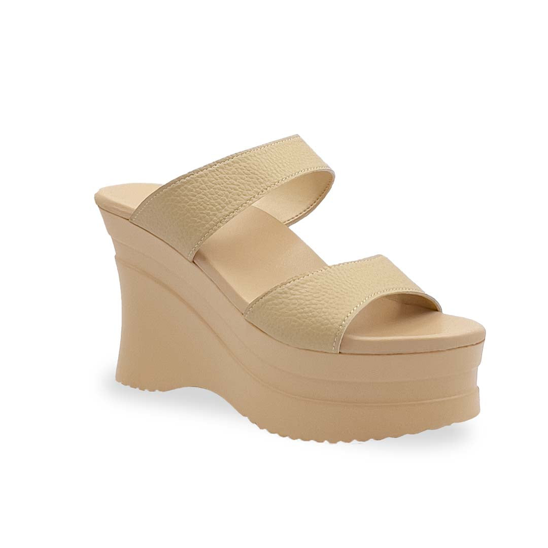 Thomas Chan's Minimalist Slip-on Heels in light mustard cream with a 4-inch platform wedge sole, featuring two wide textured lychee-finish straps and a cushioned footbed for added comfort.