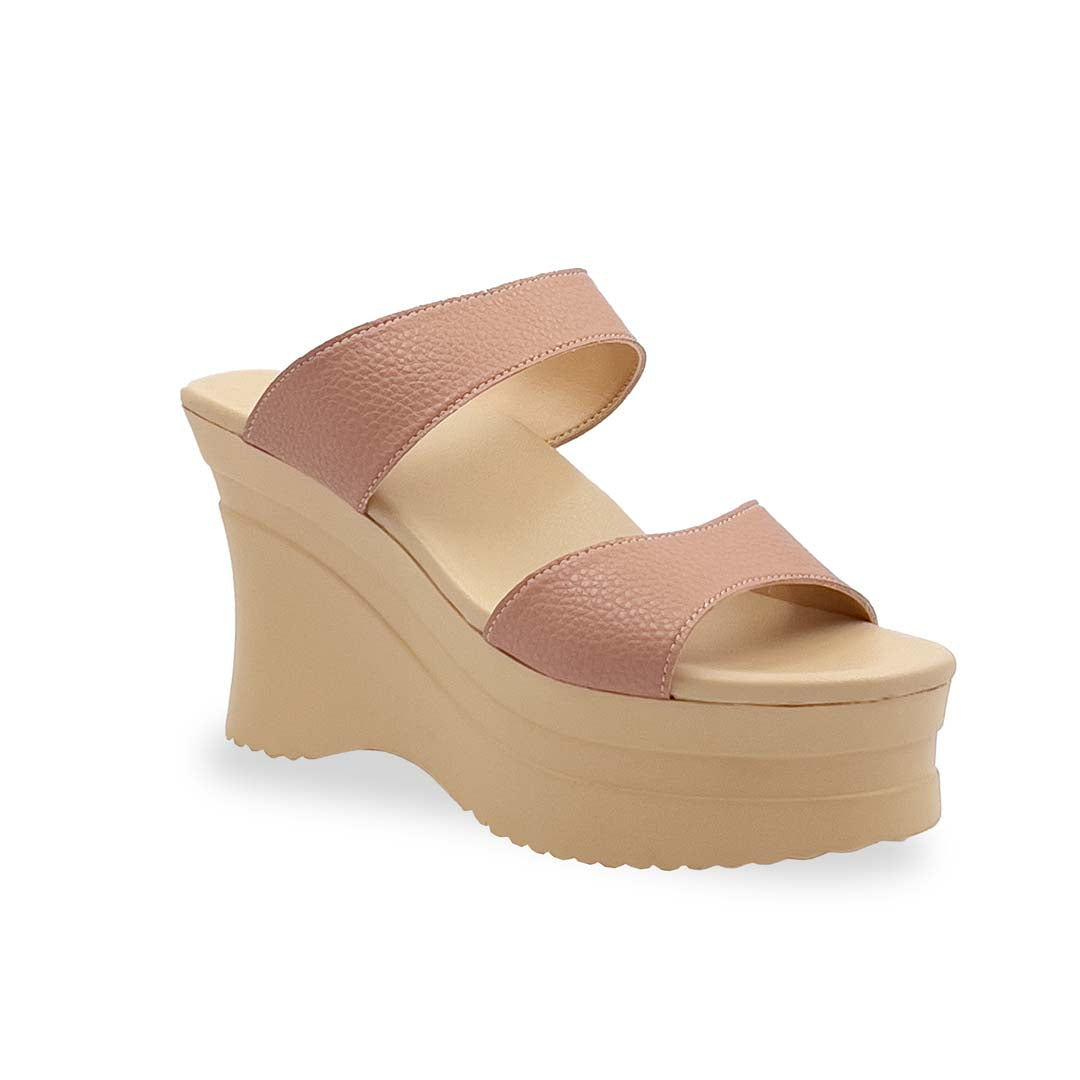 Thomas Chan's Minimalist Slip-on Heels in light pink with a 4-inch platform cream-coloured wedge sole, featuring two wide textured lychee-finish straps and a cushioned footbed for added comfort.