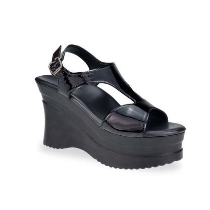 A dynamic diagonal shot highlighting the structured silhouette, 4-inch heel, and elegant shine of the patent leather.