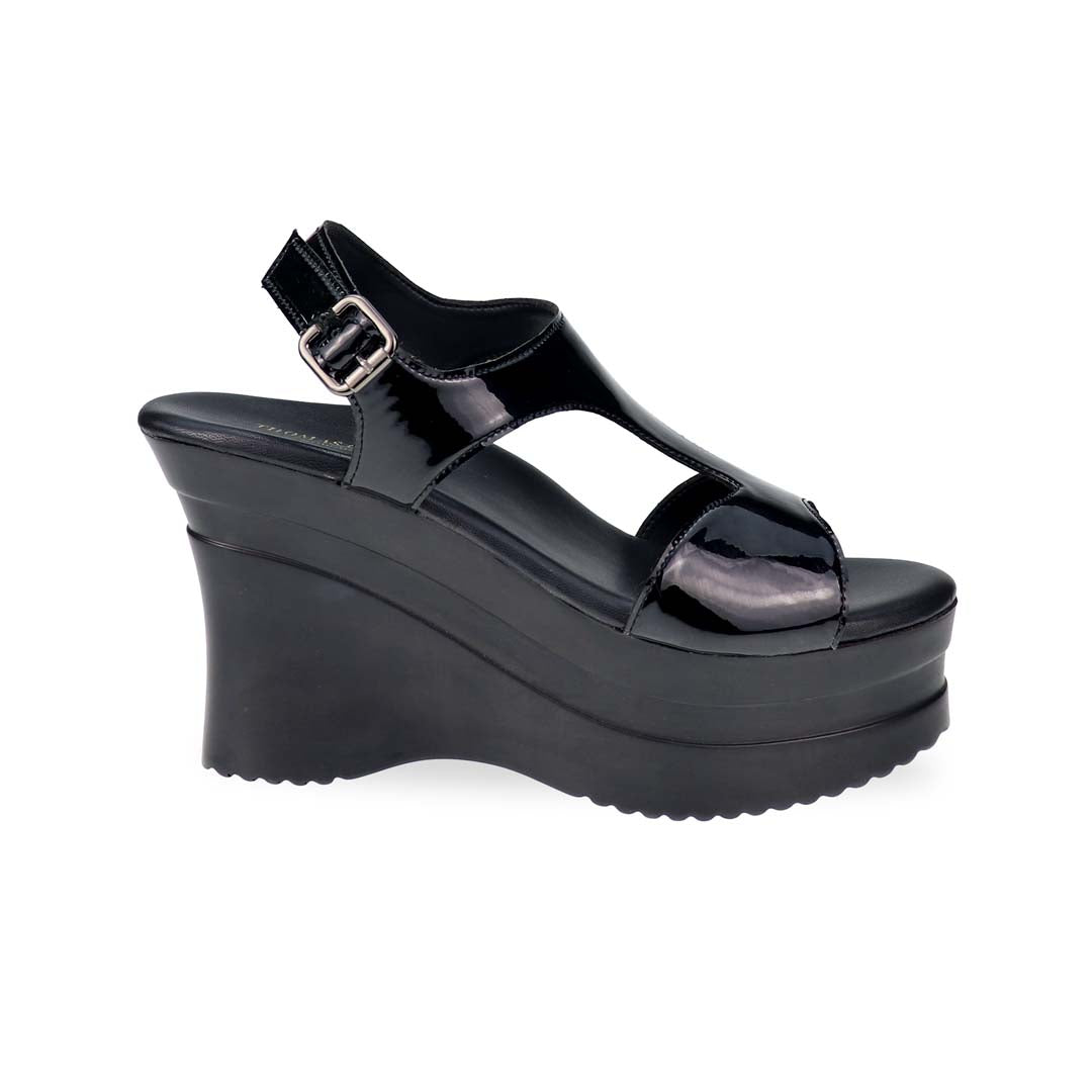 A sleek side-angle shot of Thomas Chan’s Patent Leather Slingback Heels in 4 inch, showcasing the glossy patent leather finish, cushioned footbed, and secure slingback strap.