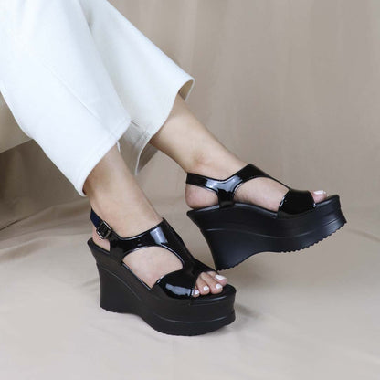A model effortlessly wearing the Thomas Chan Patent Leather Slingback Heels, showcasing their sophisticated appeal and comfort for day-to-night wear.