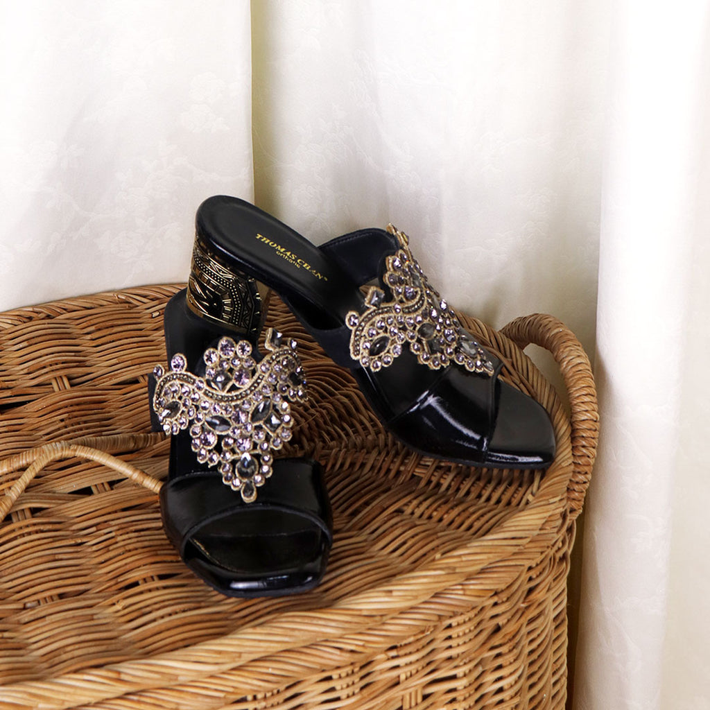 Thomas Chan's Black Glamour Vintage Rhinestone Block Heels: Embrace classic elegance with a touch of sparkle. Perfect for dinners and special events, these vintage-inspired heels adorned with rhinestones exude timeless allure.