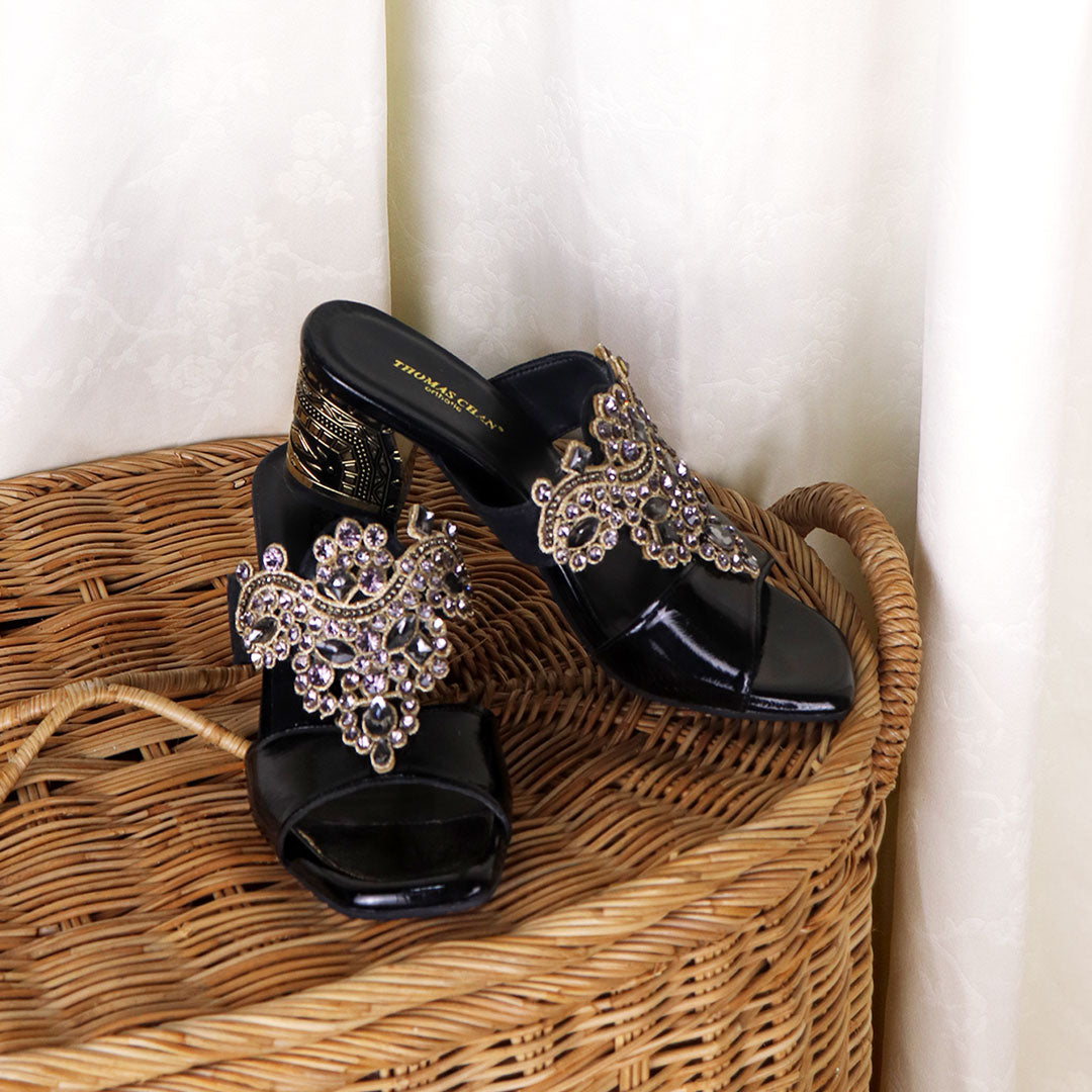 Thomas Chan's Black Glamour Vintage Rhinestone Block Heels: Embrace classic elegance with a touch of sparkle. Perfect for dinners and special events, these vintage-inspired heels adorned with rhinestones exude timeless allure.