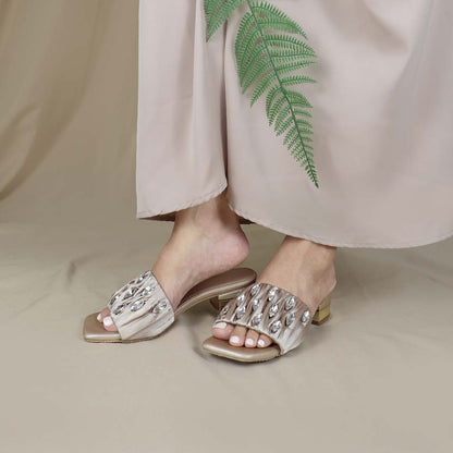 Model wearing Crystal Lux Satin Evening Heels in rose gold indoors, showcasing the luxe satin finish and statement crystal details — stylish yet comfortable heels for weddings, events, or formal dinners.