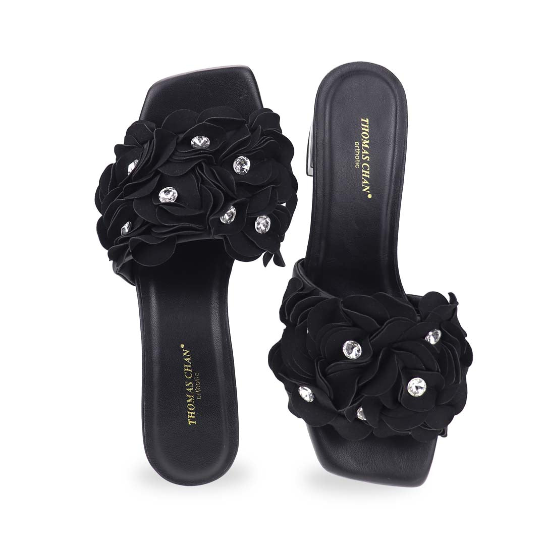 Front view of the Blooming Flower Evening Heels against a studio background, emphasizing the detailed flower design and crystal embellishments on the straps.