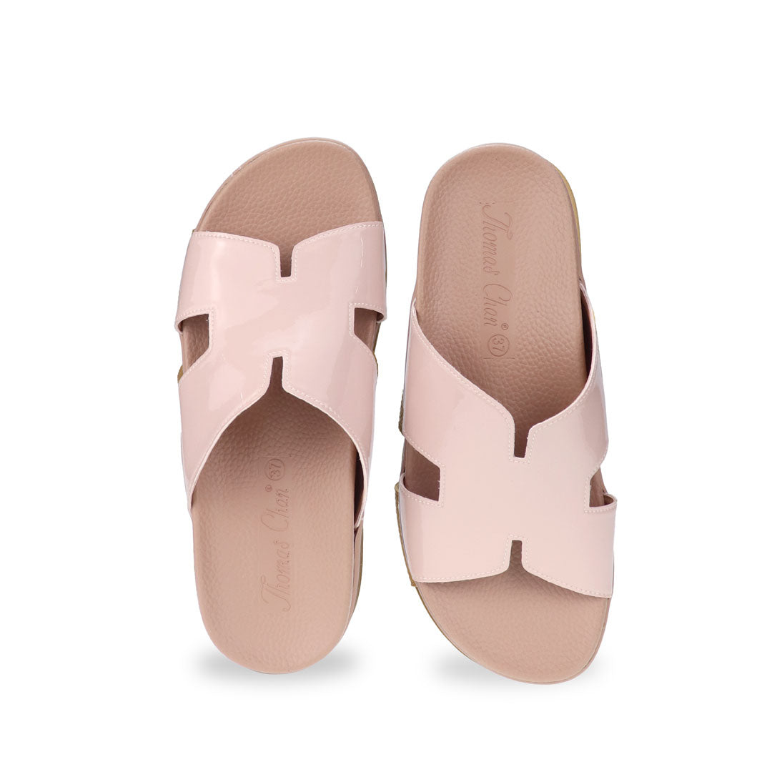 A straight-on front view of Thomas Chan’s Extra Comfort H-Strap Flats in Nude Pink, displaying the classic H-strap silhouette and minimalist design.