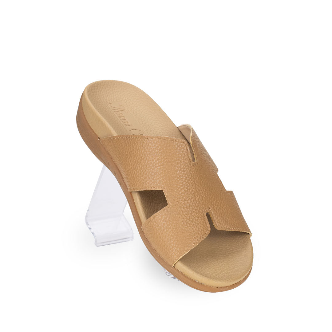 Diagonal view of Thomas Chan Extra Comfort H-Strap Flats in camel color, featuring built-in insoles for excellent arch support