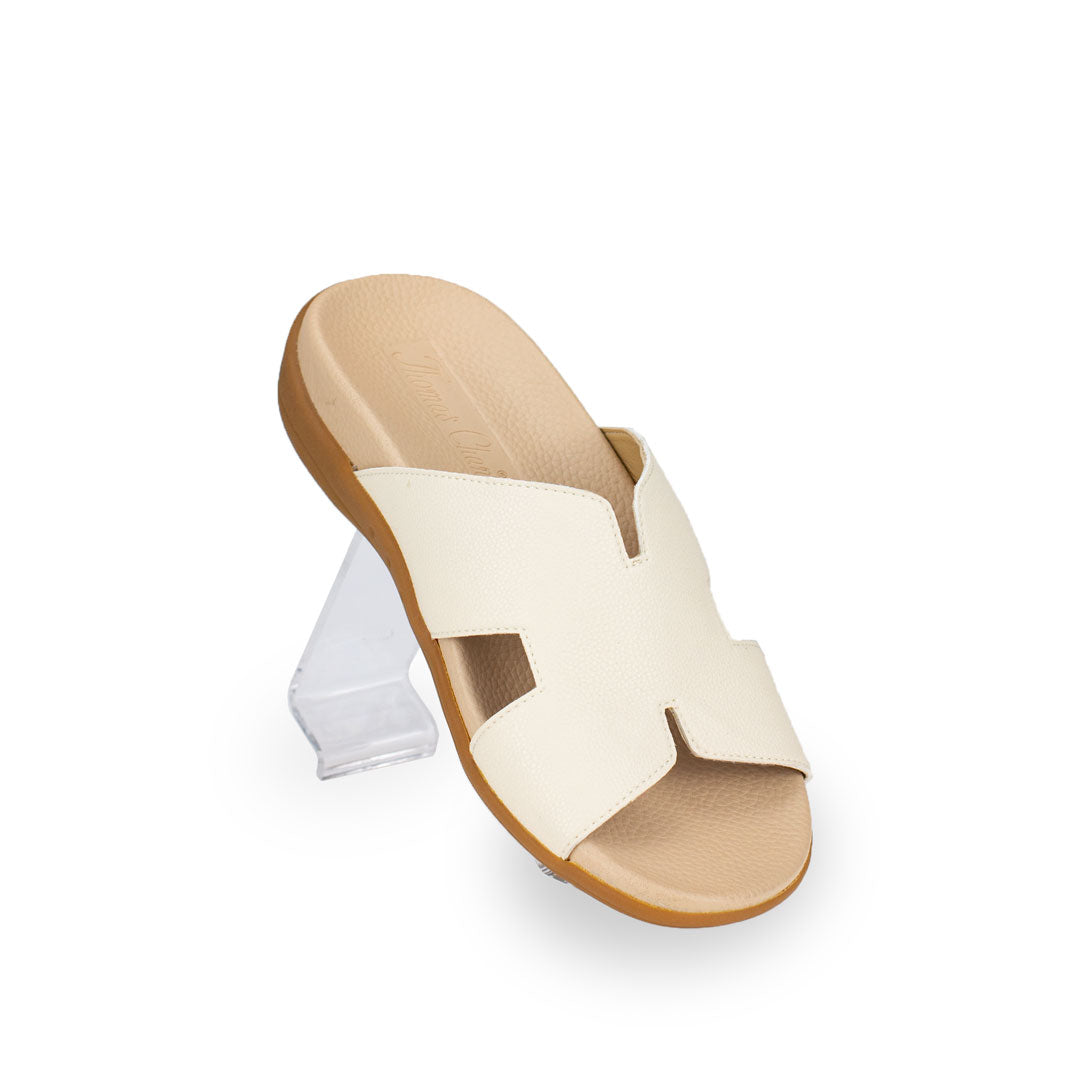 Diagonal view of Thomas Chan Extra Comfort H-Strap Flats in ivory colour, featuring with in-built insoles for excellent arch support