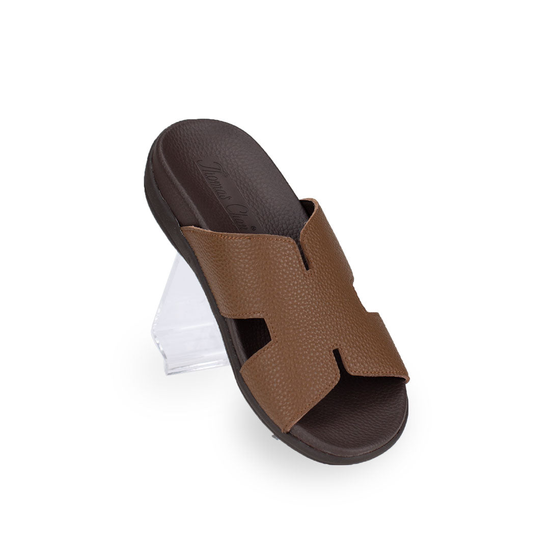 Diagonal view of Thomas Chan Extra Comfort H-Strap Flats in light brown color, featuring built-in insoles for excellent arch support
