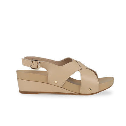 Side view of Thomas Chan Cross Strap Slingback Low Wedge Sandals in cream, incorporating arch-support insoles for superior comfort and effortless walking experience.