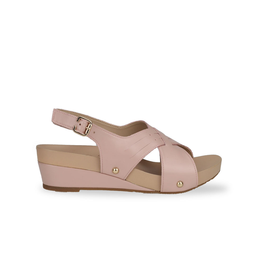Side view of Thomas Chan Cross Strap Slingback Low Wedge Sandals in pink, featuring built-in arch-support insoles for enhanced comfort and ease of walking