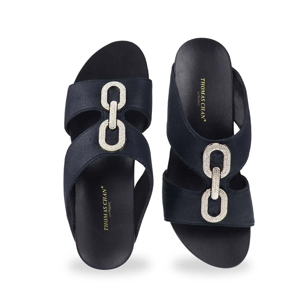 Front view of Aurora Chain High Wedges showing sparkling buckle details and open-toe design with luxe shimmer.