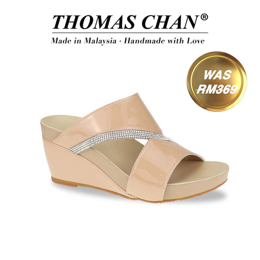 A sleek diagonal profile of the Thomas Chan Diamond Strap Dinner Wedges from the Arch-legance collection, showcasing the elegant multi-row diamond strap and a low wedge heel for a graceful lift. The Orthotic Arch-legance footbed ensures both style and comfort."THOMAS CHAN®" brand displayed with "Made in Malaysia · Handmade with Love" below. Gold and white banner highlights special offer: "Was RM369".