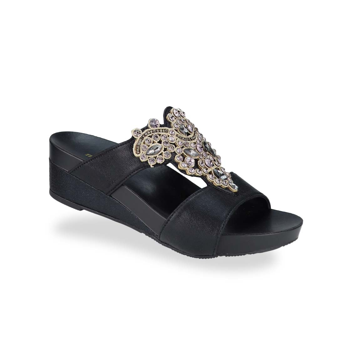 Diagonal view of Thomas Chan's Vintage Rhinestone Low Wedge Sandals in black, adorned with vintage-inspired rhinestone detailing ,and an arch-support footbed.