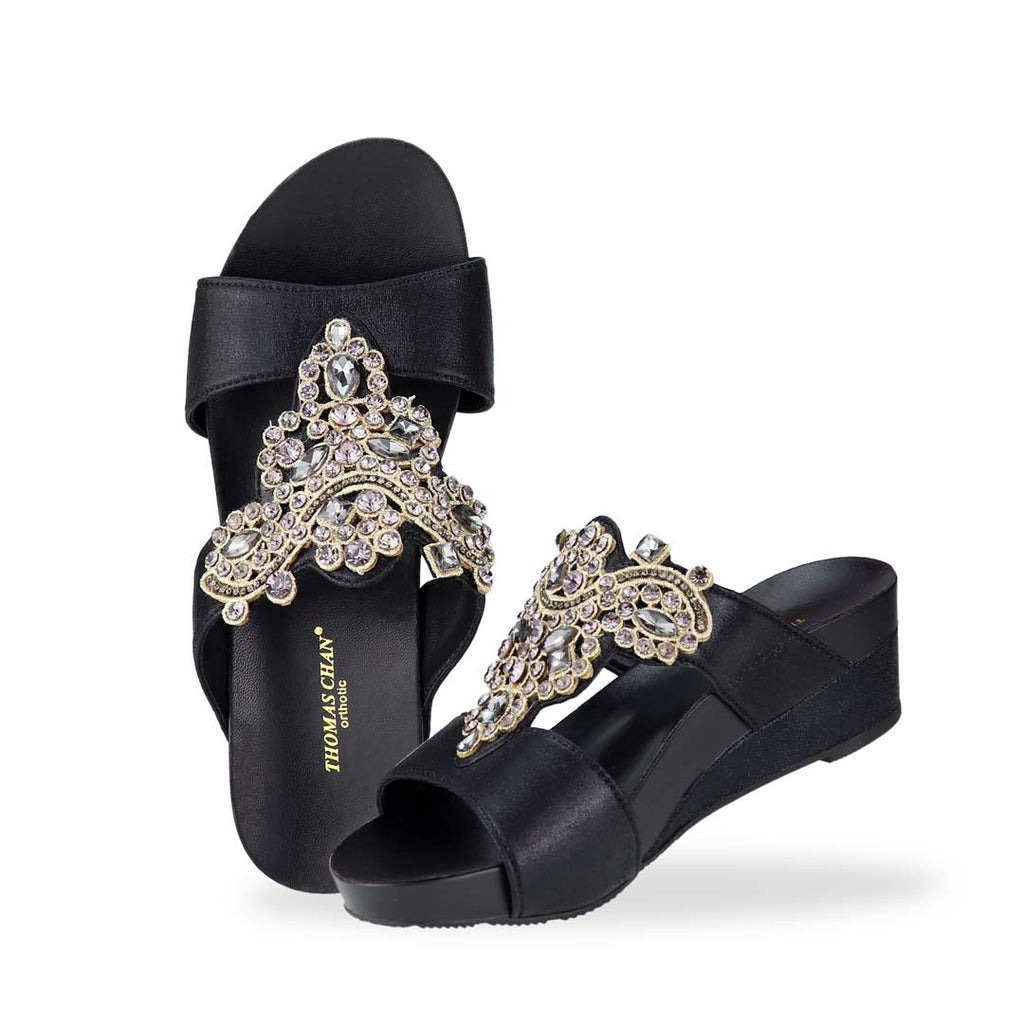 Full view of Thomas Chan's Vintage Rhinestone Low Wedge Sandals in black, adorned with vintage-inspired rhinestone detailing ,and an arch-support footbed.