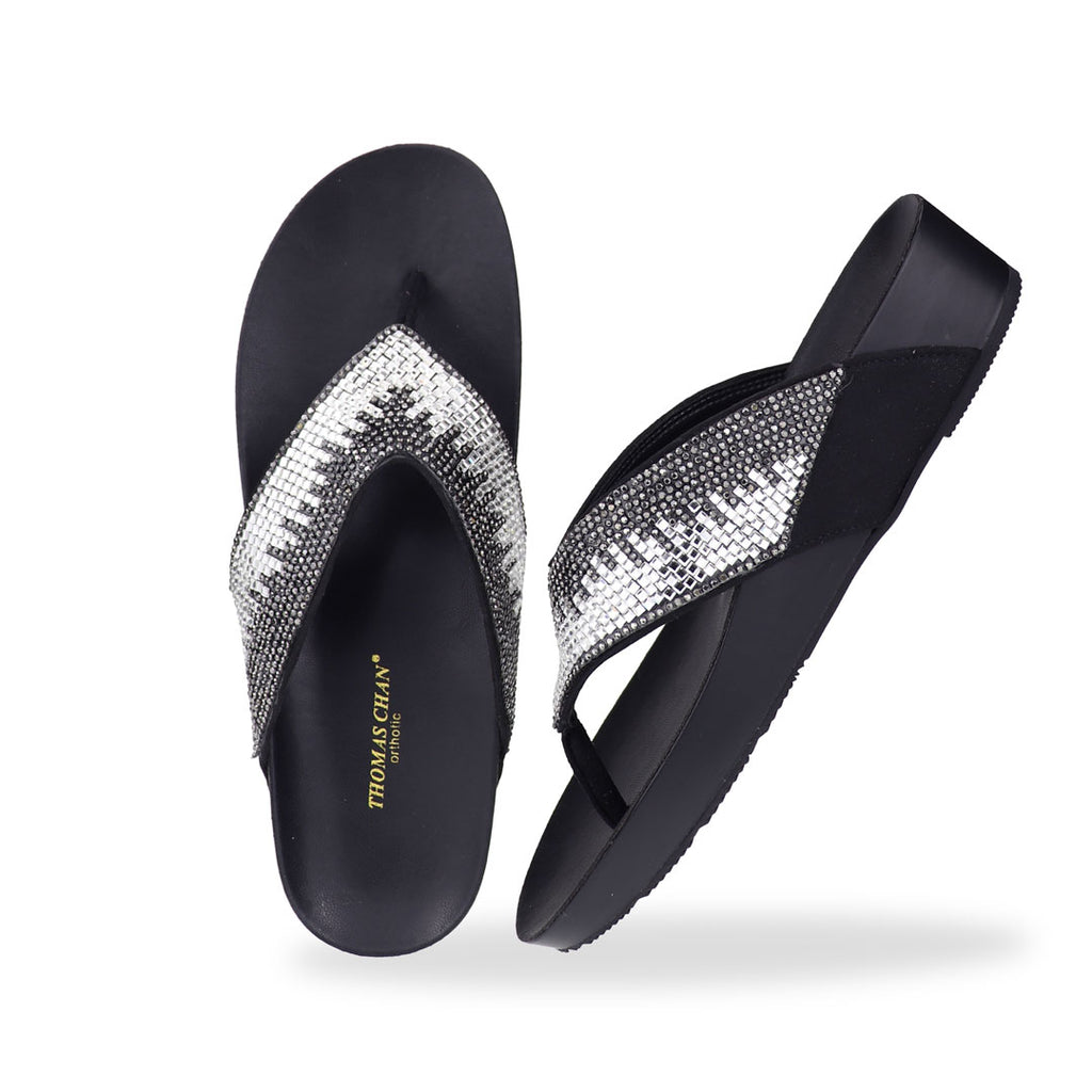 Full view of Thomas Chan’s black suede rhinestone flip-flops highlighting the elegant suede texture, rhinestone detailing, and LiteStep flatform footbed.