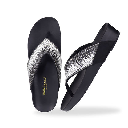 Full view of Thomas Chan’s black suede rhinestone flip-flops highlighting the elegant suede texture, rhinestone detailing, and LiteStep flatform footbed.