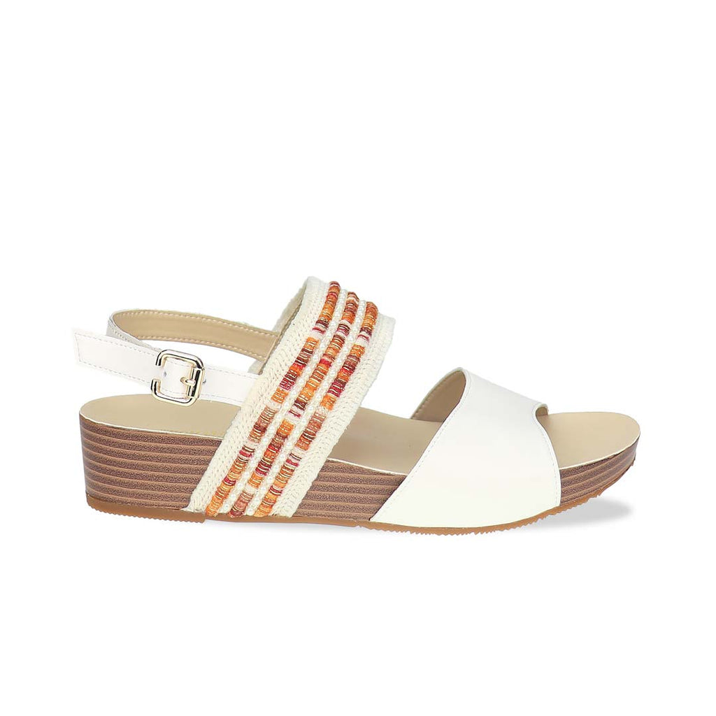 Side view of Thomas Chan’s Summer Love Duo-Strap Slingback Sandals in ivory with a subtle touch of orange, featuring elegant duo straps, a secure slingback design, and a LiteStep flatform sole with light arch support, highlighting their casual yet sophisticated style.