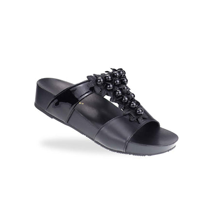 Diagonal view of Thomas Chan Petal Pearl Flatform Sandals in black—highlighting pearl-petal embellishments and gentle height from LiteStep sole.