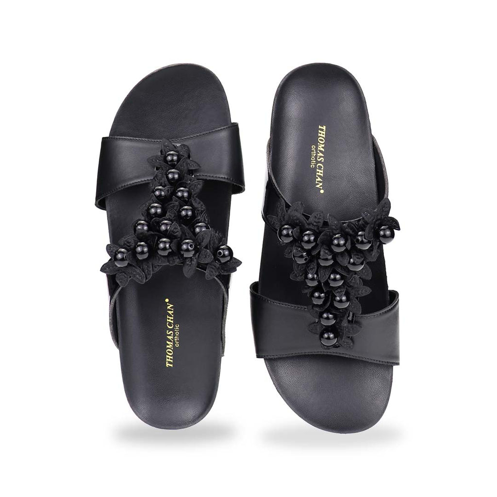 Front view of Thomas Chan Petal Pearl Flatform Sandals with centered pearl flower design on black strap, perfect for elegant comfort.