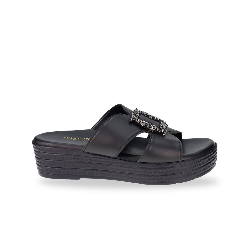 Side profile of the Thomas Chan Vintage Framed Flatform Sandals in black, showcasing the layered bronze flatform sole and soft cushioned upper with a detailed black silver frame buckle.