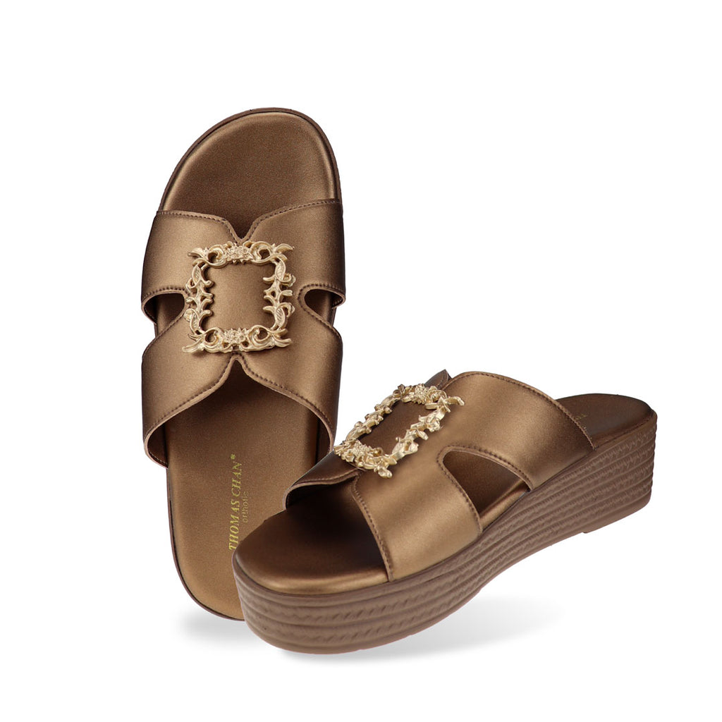 Full studio view of Thomas Chan Vintage Framed Flatform Sandals in bronze, showing both the cushioned footbed and side profile of the elegant sandal with a gold vintage-style buckle.