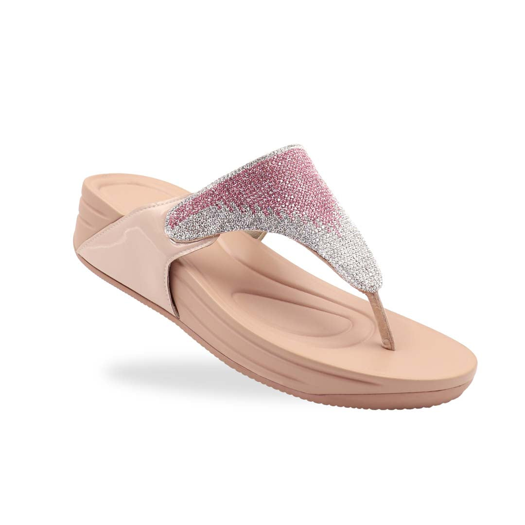 A close-up diagonal shot of the Diamond Embellished Flip-Flop Sandals in Nude Pink from the Bounce Care Series, placed on a clean studio background. The shimmering crystal-embellished straps catch the light, while the cushioned flatform sole is visible from the side, highlighting its gentle elevation and soft rubber texture.