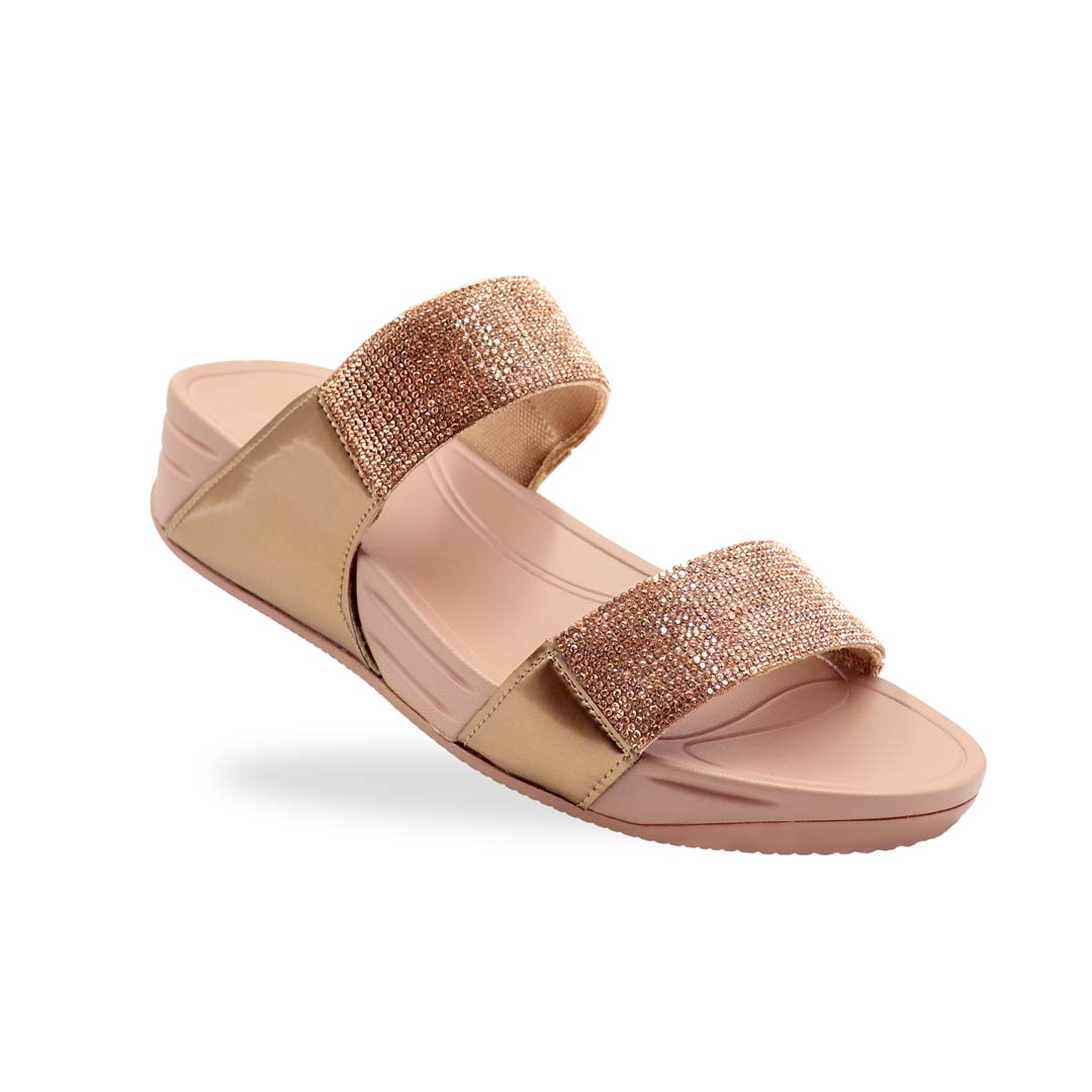 A diagonal view of the Diamond Embellished Duo-Strap Bounce Care Sandals in Bronze, highlighting the sparkling crystal-adorned straps and cushioned rubber sole. The slight elevation of the footbed is visible, offering both style and comfort against a neutral background.