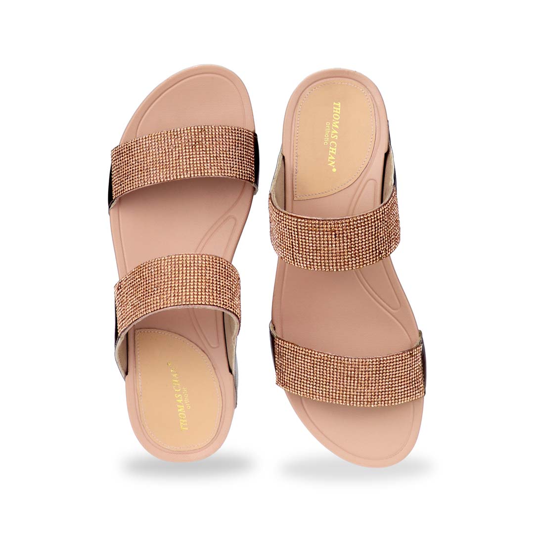 A front-facing view of the Diamond Embellished Duo-Strap Bounce Care Sandals in Bronze, focusing on the detailed crystal embellishments on the wide straps. The open-toe design enhances breathability, making it a stylish and comfortable choice for any occasion.