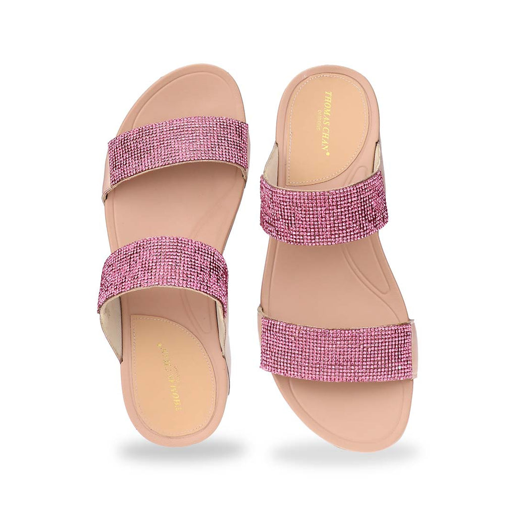A front-facing view of the Diamond Embellished Duo-Strap Bounce Care Sandals in Nude Pink, focusing on the detailed crystal embellishments on the wide straps. The open-toe design enhances breathability, making it a stylish and comfortable choice for any occasion.