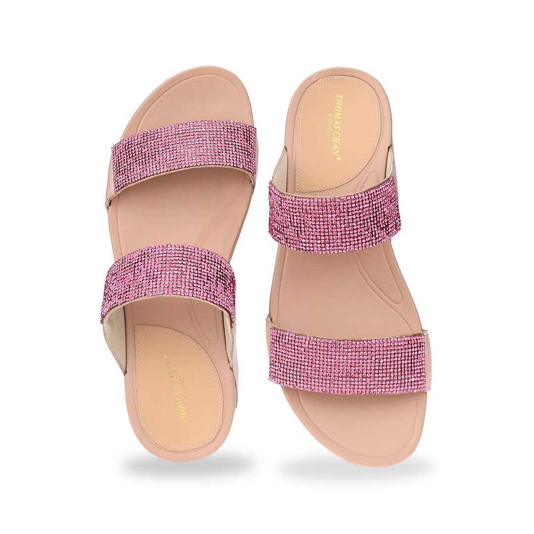 A front-facing view of the Diamond Embellished Duo-Strap Bounce Care Sandals in Nude Pink, focusing on the detailed crystal embellishments on the wide straps. The open-toe design enhances breathability, making it a stylish and comfortable choice for any occasion.