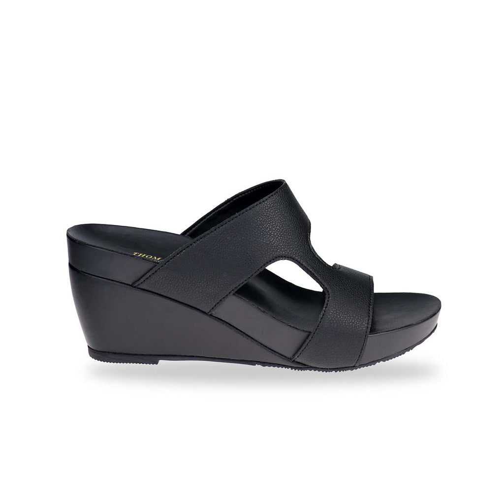 Side view of Simplicité High Wedges in matte black — high wedge sandals with sleek lines and arch-support footbed, designed for modern minimalists.