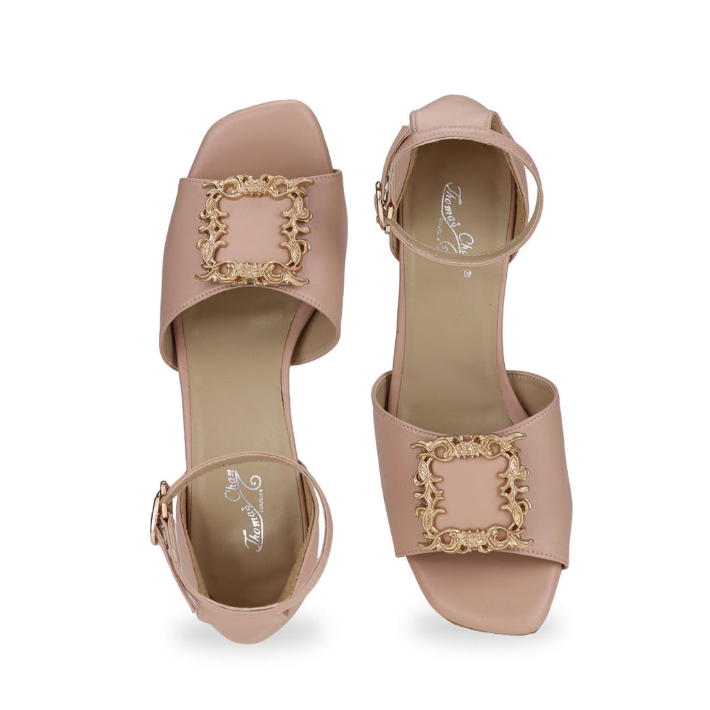 Front view of ankle-strap heeled sandals with vintage frame buckle in pink by Thomas Chan.