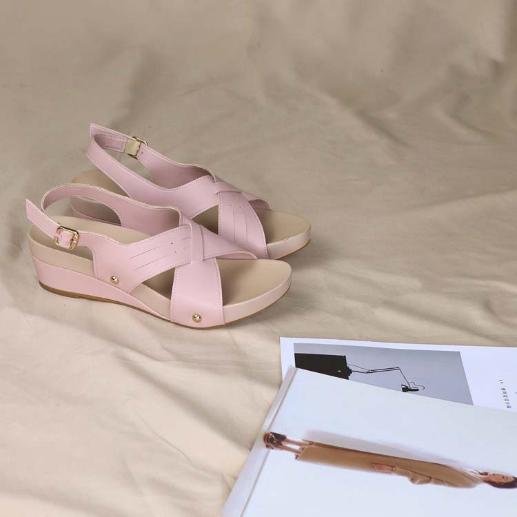 Stylish perspective of Thomas Chan Cross Strap Slingback Low Wedge Sandals in pink, engineered with built-in arch-support insoles to enhance comfort and promote effortless walking.
